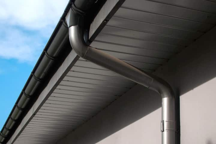 Corrosion-resistant galvanized gutters installed on a commercial building in St Augustine